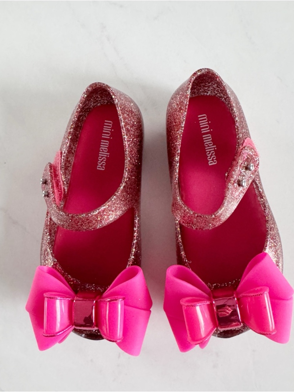 Mini Melissa Glitter Pink Mary Janes with Hot Pink Bow